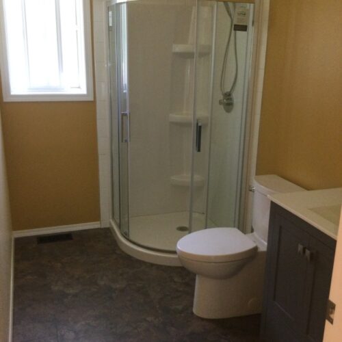 Reversible tub to shower conversion with low step entry for mobility friendly bathroom accessibility.