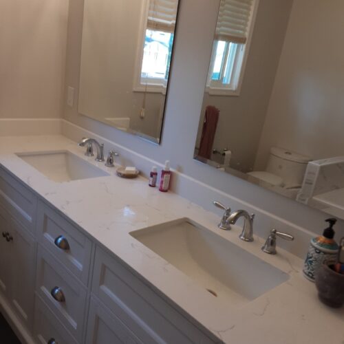 Reversible tub to shower conversion with low step entry for mobility friendly bathroom accessibility.