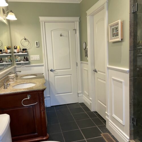 Reversible tub to shower conversion with low step entry for mobility friendly bathroom accessibility.