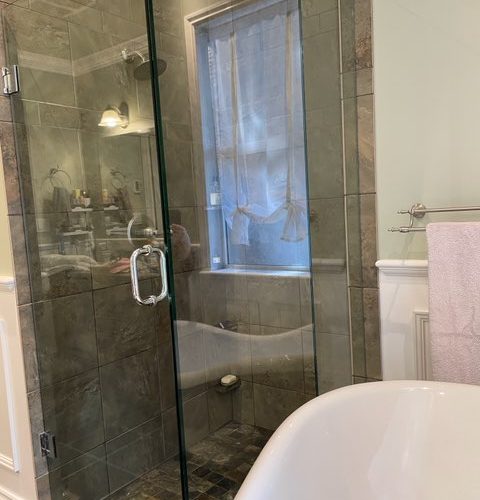 Reversible tub to shower conversion with low step entry for mobility friendly bathroom accessibility.