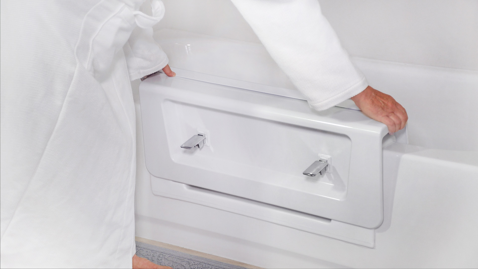 Reversible tub to shower conversion with low step entry for mobility friendly bathroom accessibility.