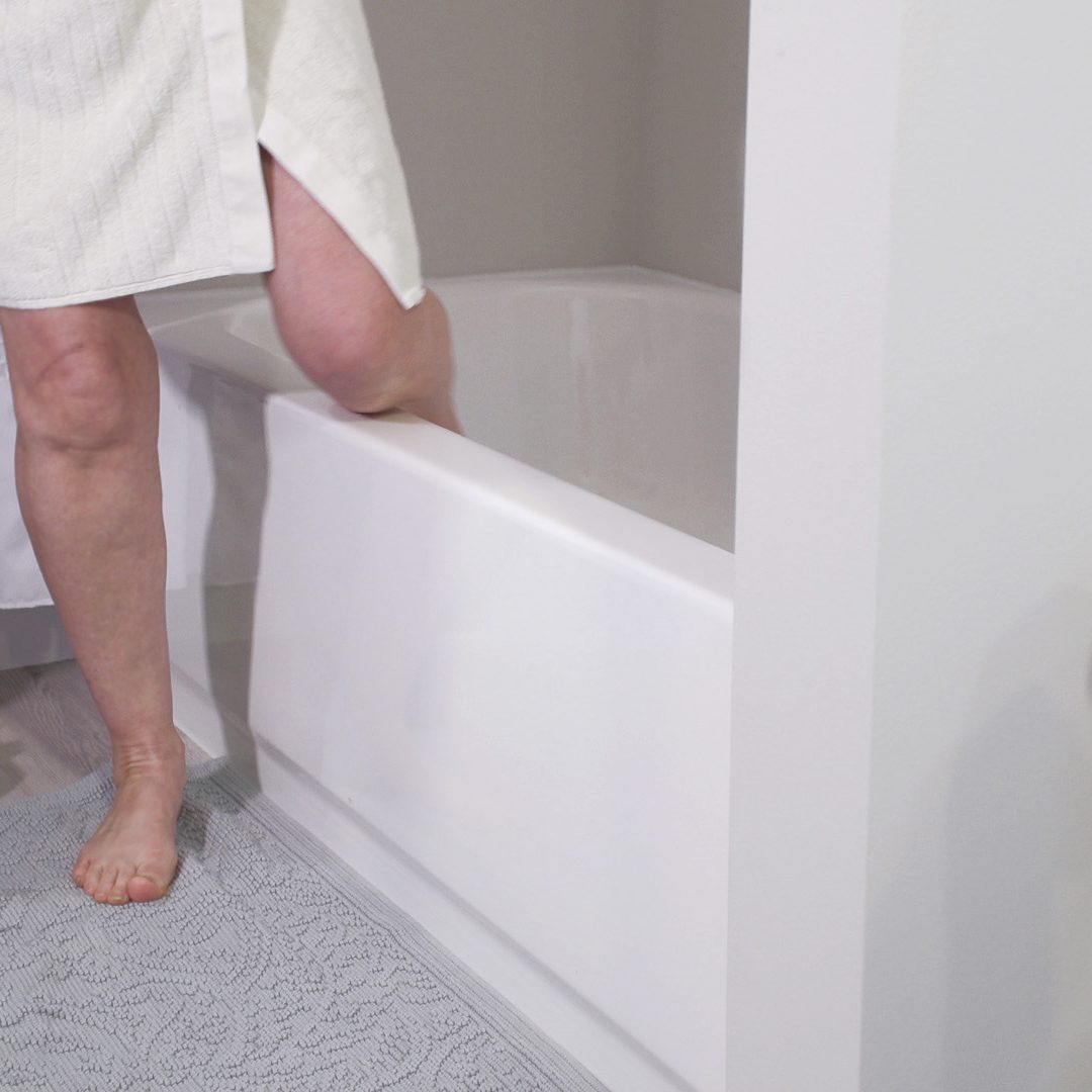 Reversible tub to shower conversion with low step entry for mobility friendly bathroom accessibility.